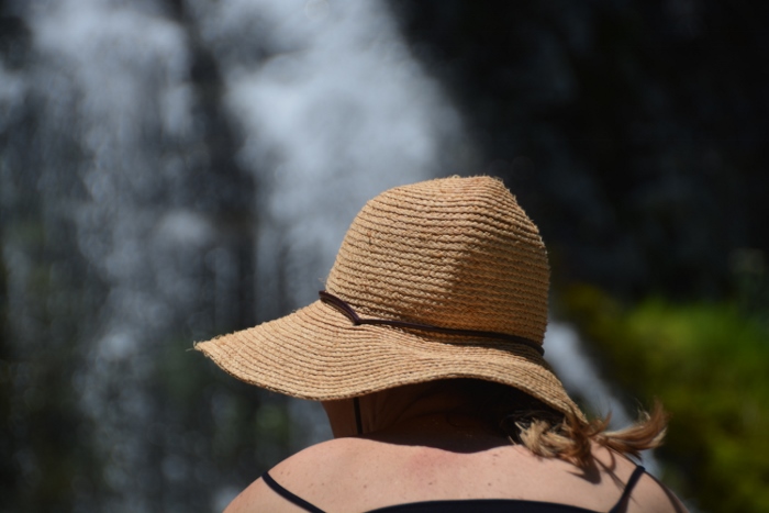lady under straw hit at falls